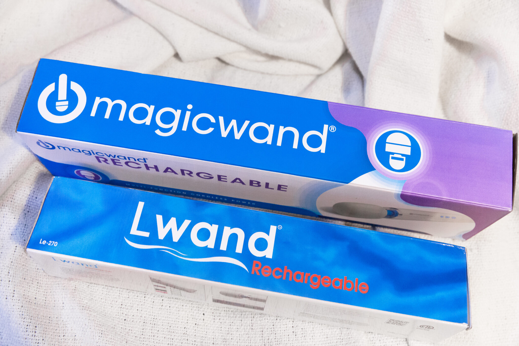 The packaging of both the authentic Magic Wand and the fake Magic Wand, branded as the "L Wand."