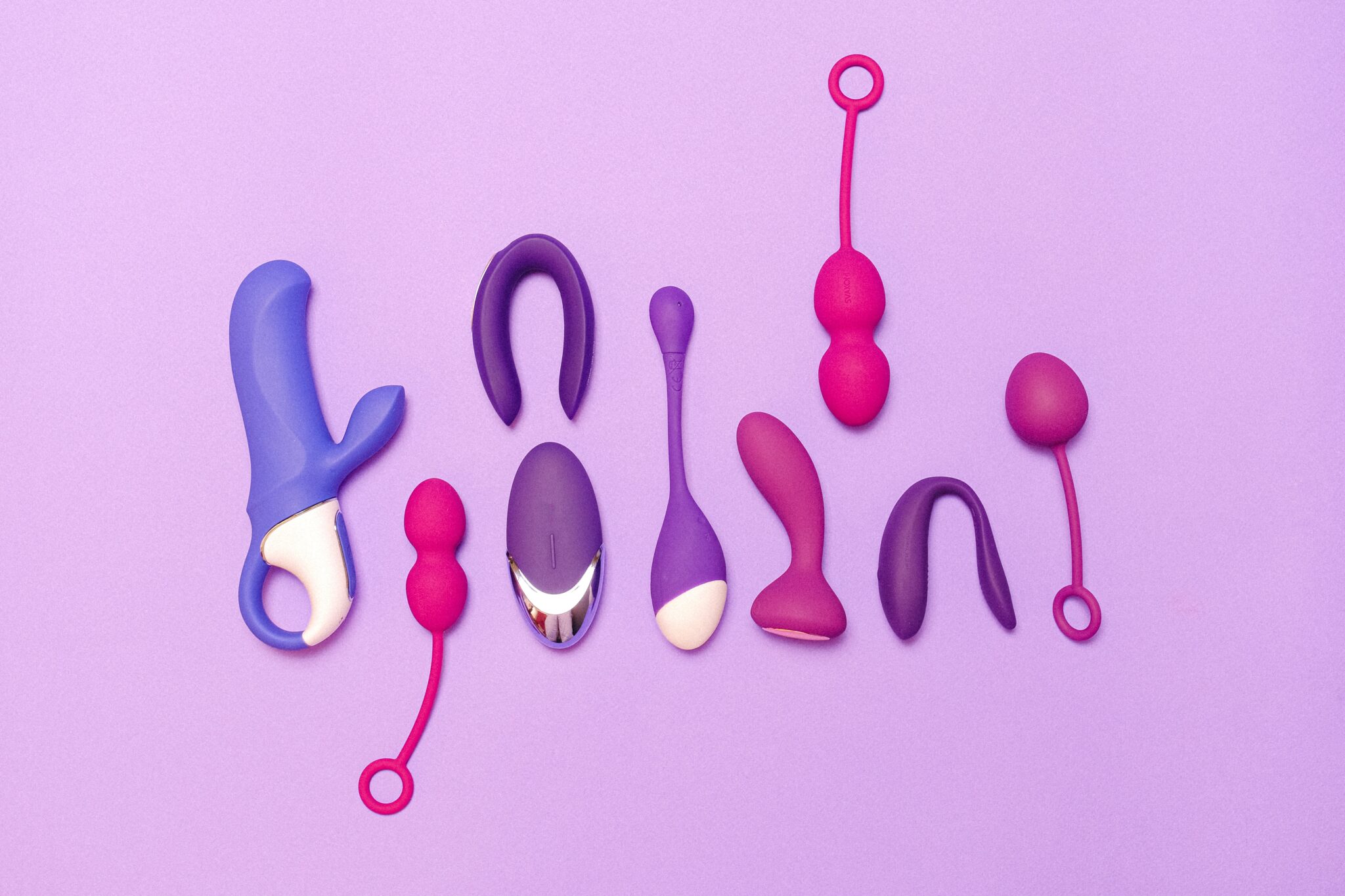 A variety of blue and purple vibrators and sex toys for women.
