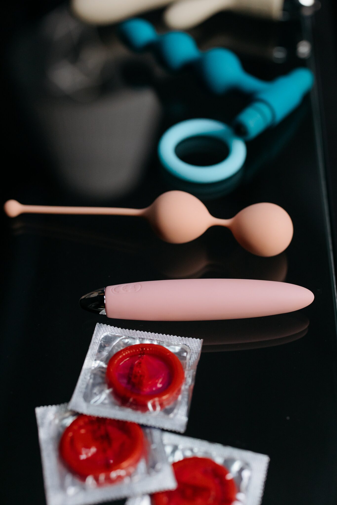 A variety of sex toys including anal beads, vibrators and condoms.