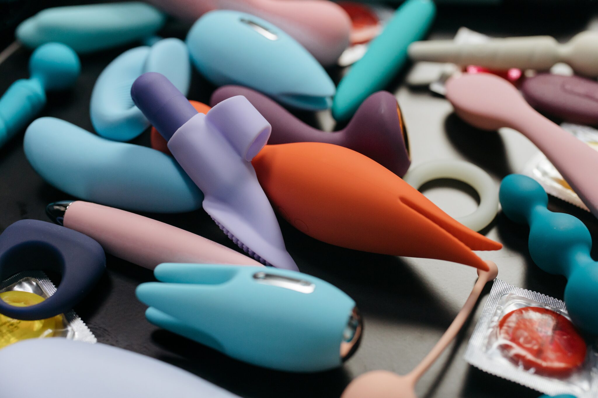 A tray full of colorful vibrators for women.