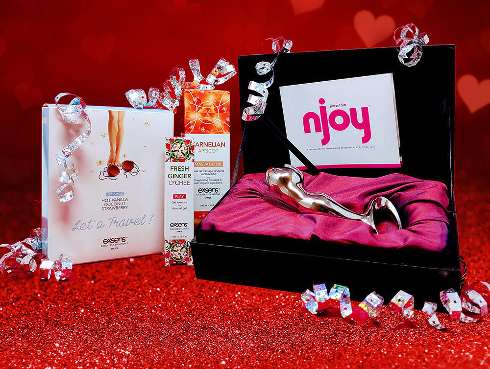 The Exsens holiday gift bundle featuring their erotic oils, sprays, lip glosses, and more for intimate couple pleasure.