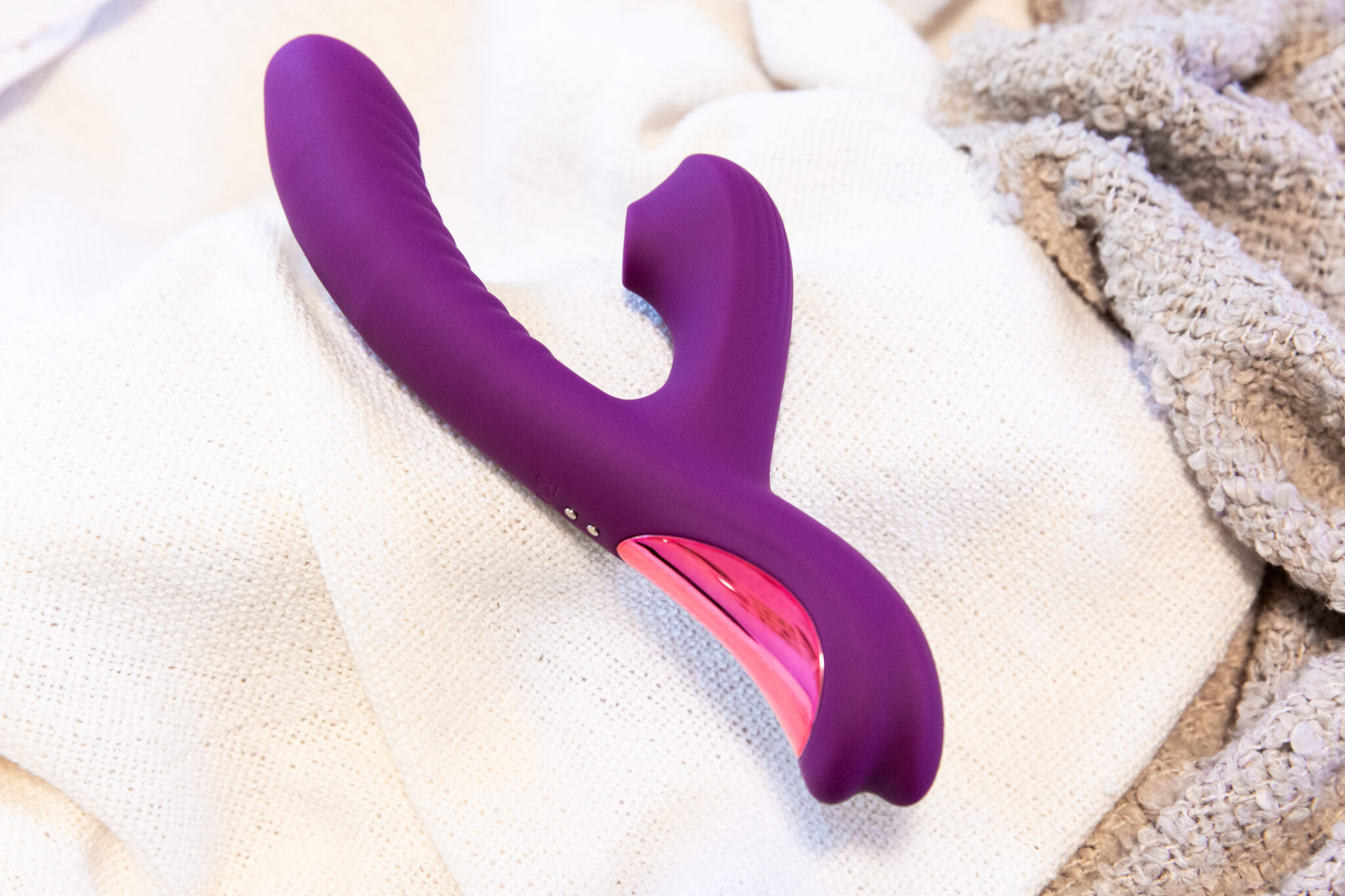 A full image of the sleek, purple Tracy's Dog Beta clit-sucking and g-spot thrusting sex toy.