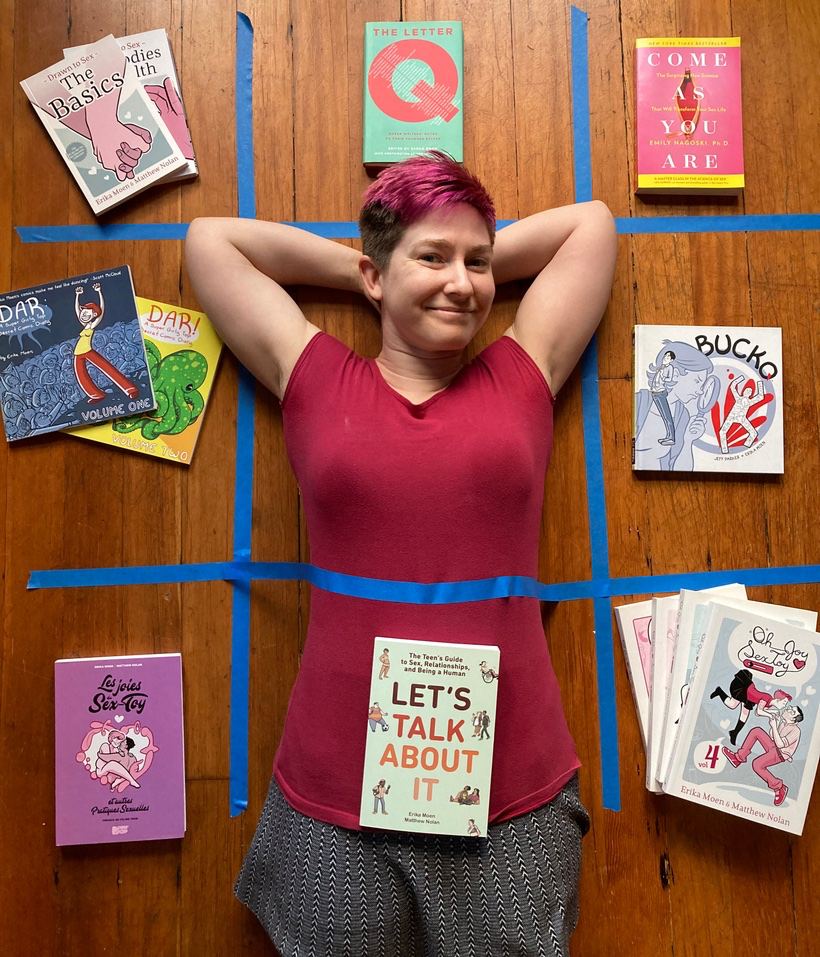 An image of Erika Moen from Oh Joy Sex Toy, laying in a grid of her comic books.