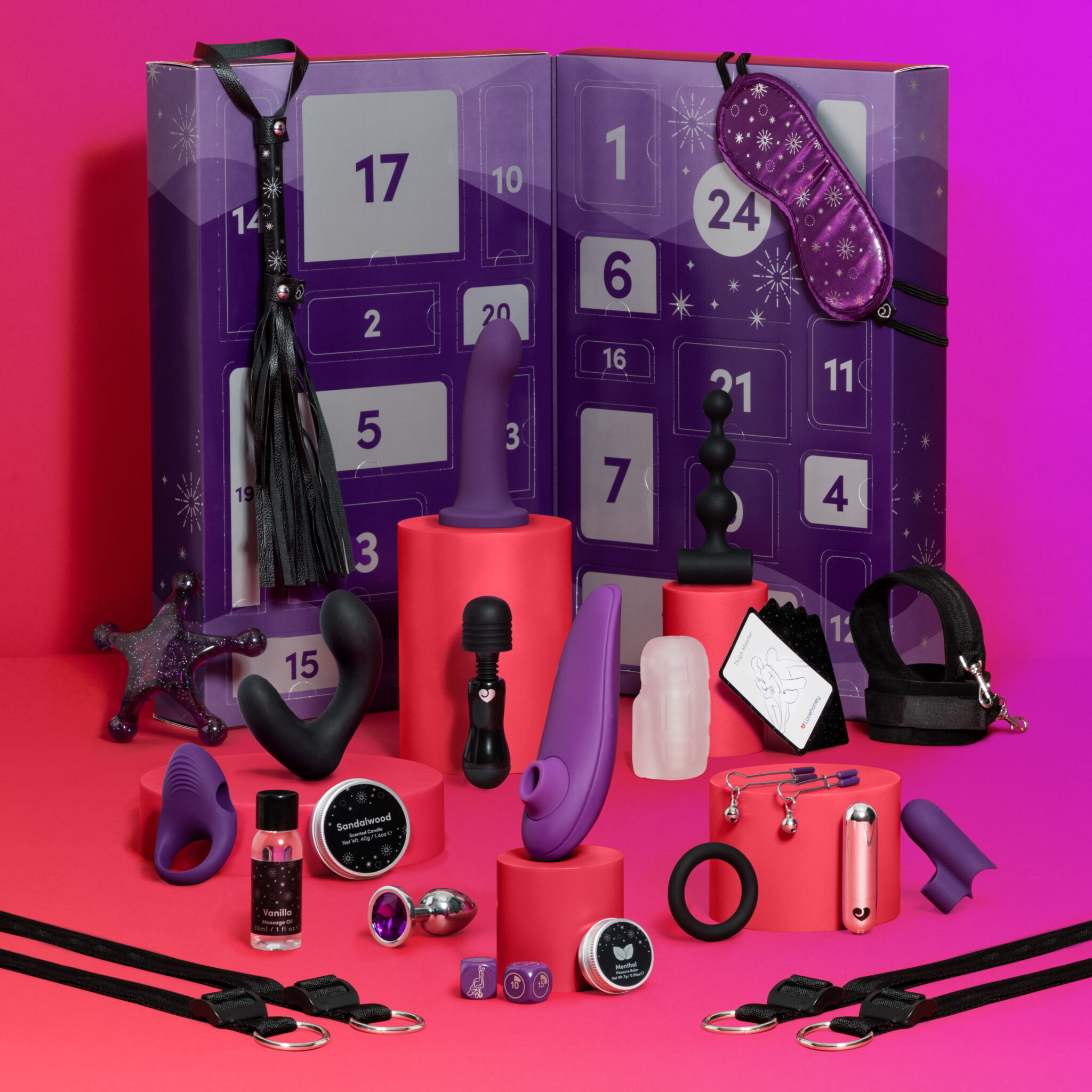 A full image of the Lovehoney X Womanizer advent calendar with its variety of sex toys and pleasure tools.