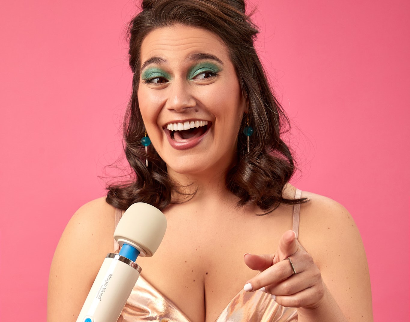 Danielle posing with a Magic Wand vibrator as a microphone.