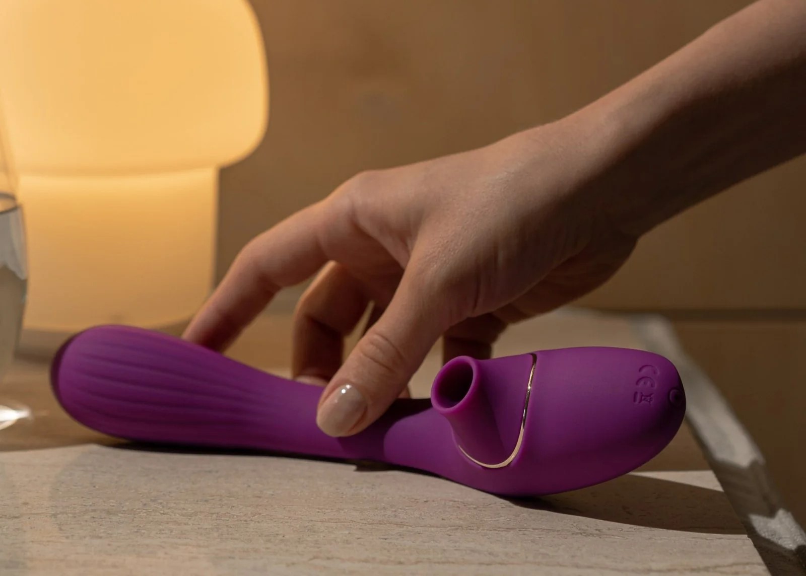 The Aura clit-sucking vibrator in purple.